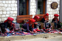 Red Dzao women peddling their handicrafts